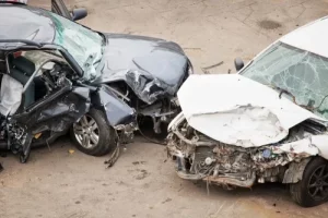 two heavily damaged cars in an accident