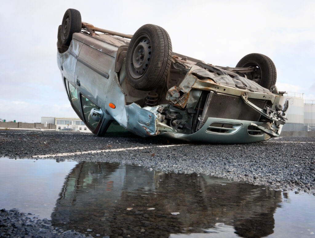 car turned upside-down after road collision, car accident trial