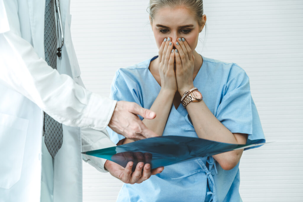 Doctor and unhappy patient at hospital or medical clinic medical malpractice scene