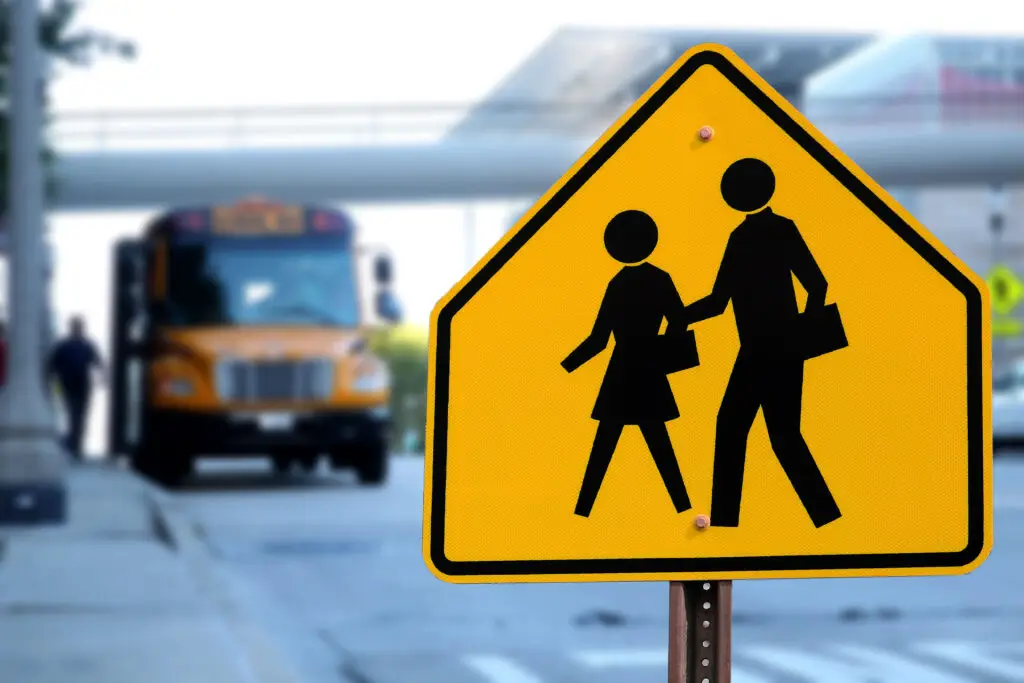 traffic sign to watch for pedestrians