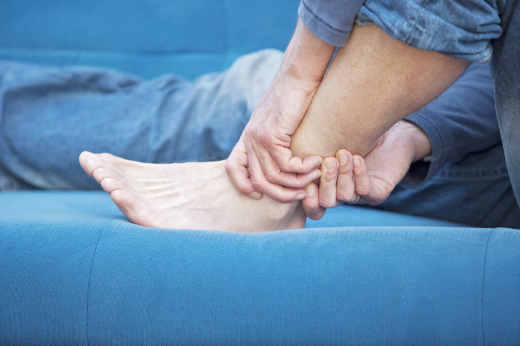 woman holding an ankle in pain after a personal injury accident