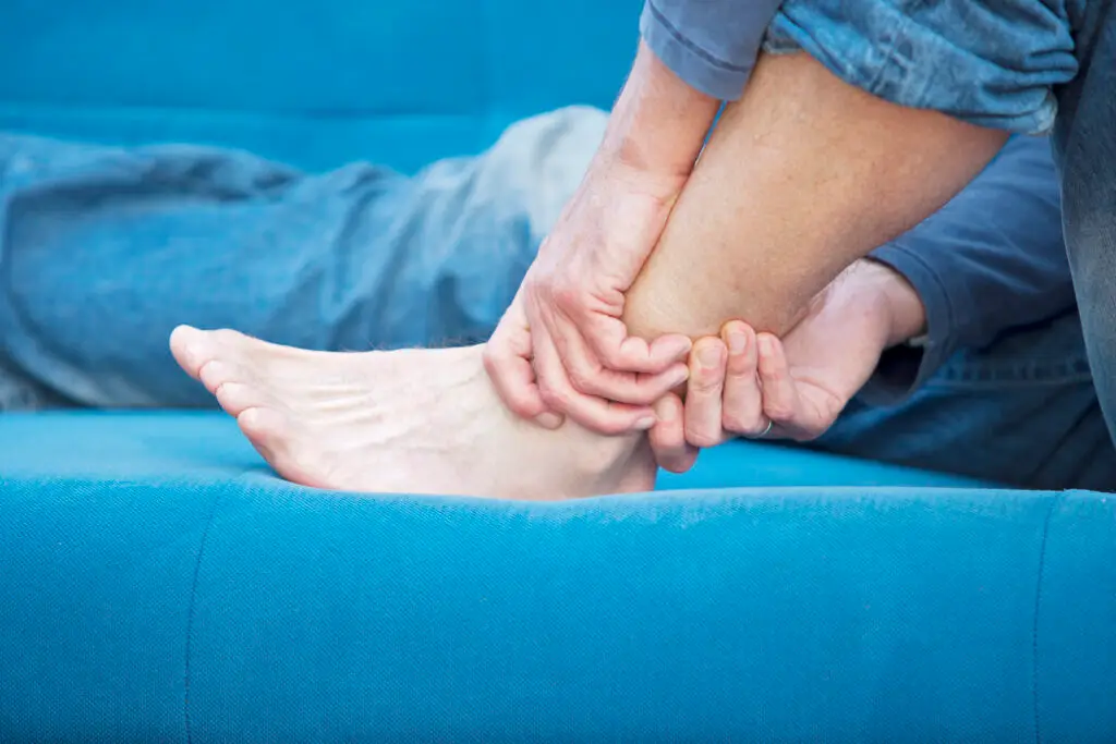woman holding an ankle in pain after a personal injury accident