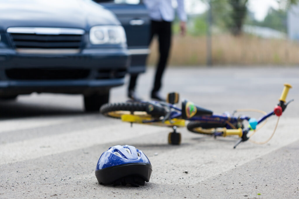 bicycle accident scene hit by a car