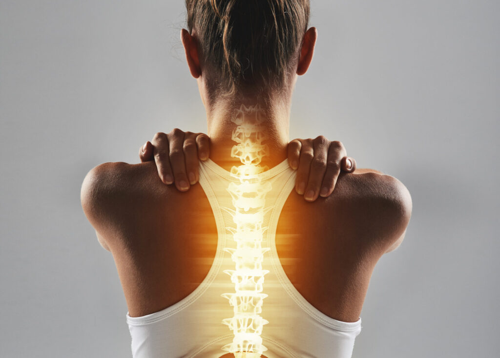 woman with a glowing spinal cord to signify a spinal cord accident