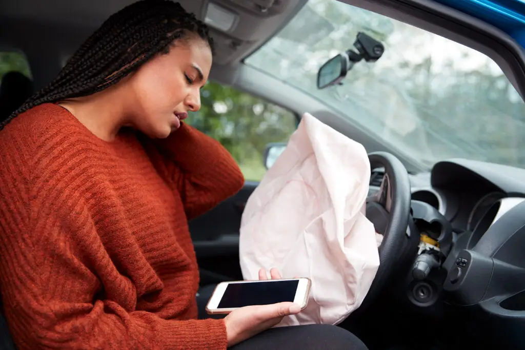 Female Motorist Injured In Car Crash After Using Mobile Phone Whilst Driving, personal injury concept