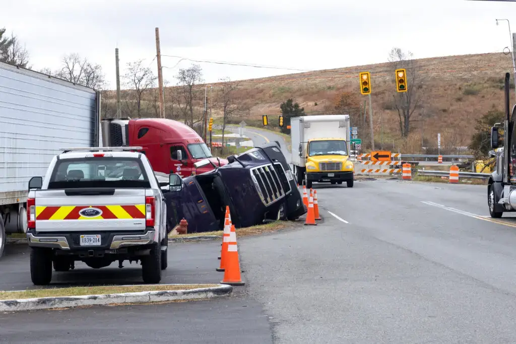 truck accident in chesapeake virginia in an intersection, truck flipped over on the side of the road