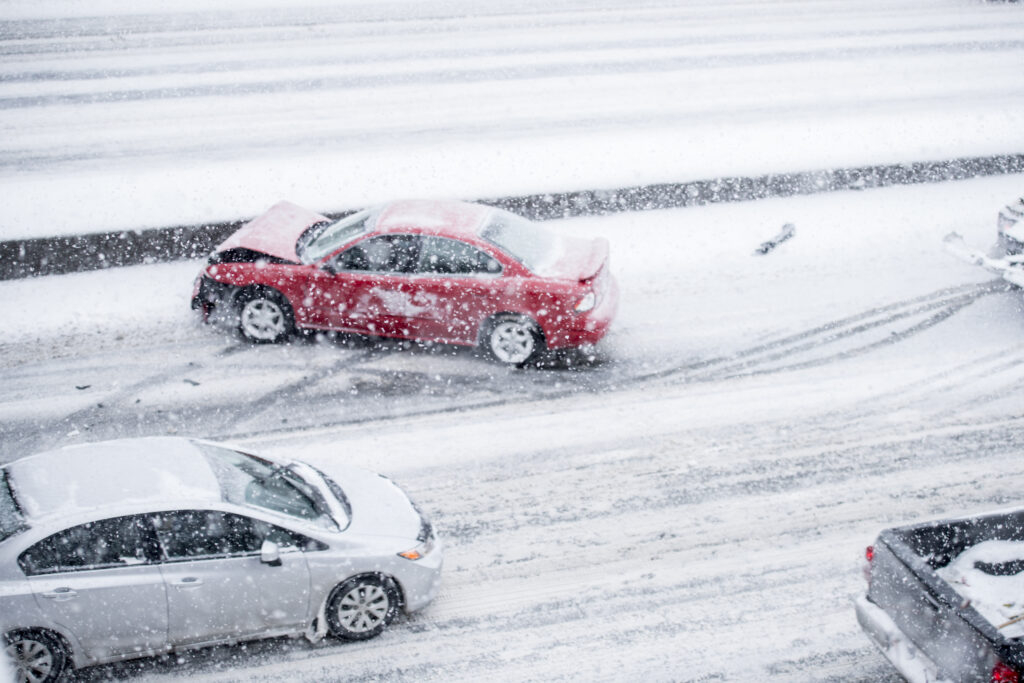 snowy road conditions lead to a car accident
