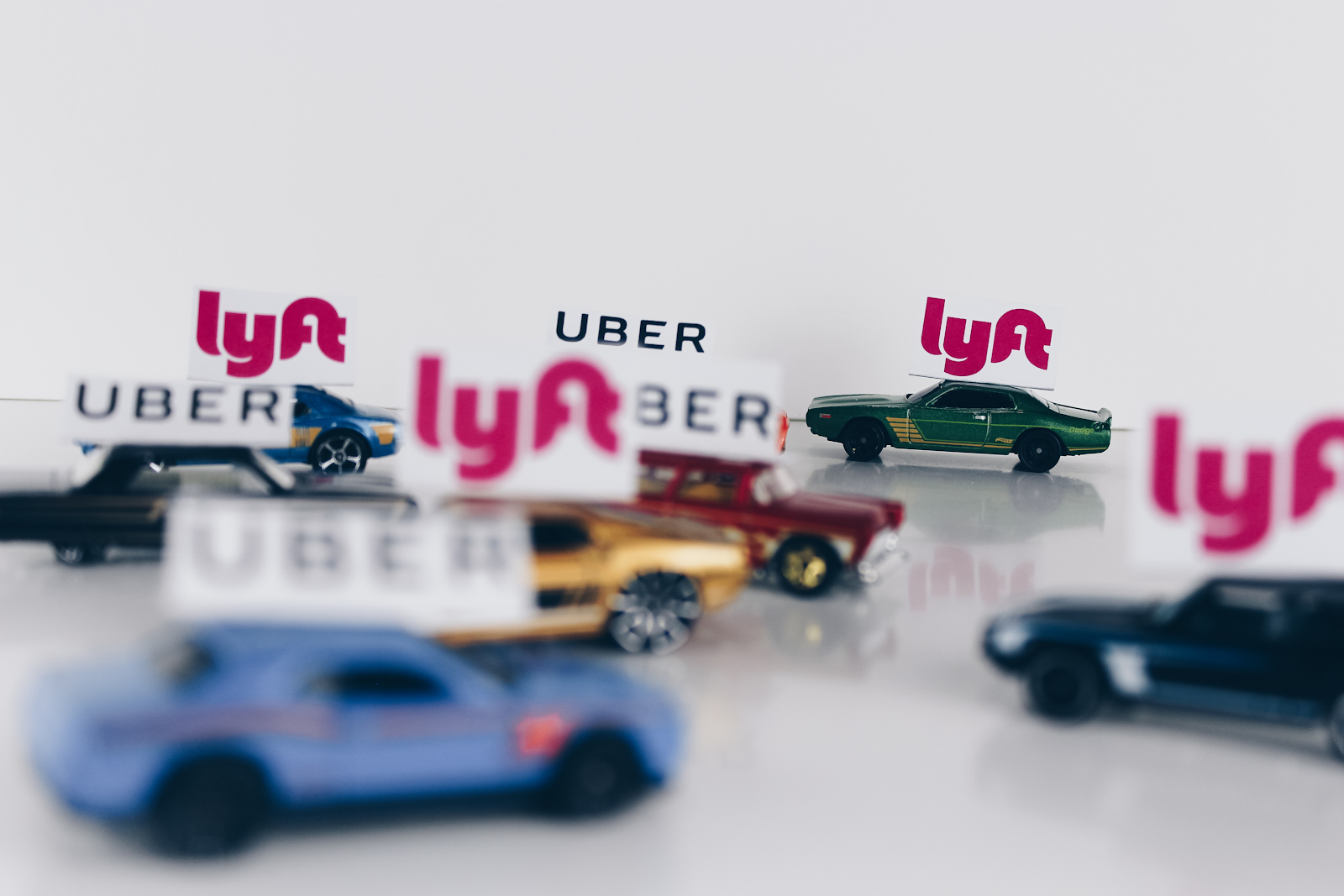 tiny matchbox cars that have uber and lyft on them