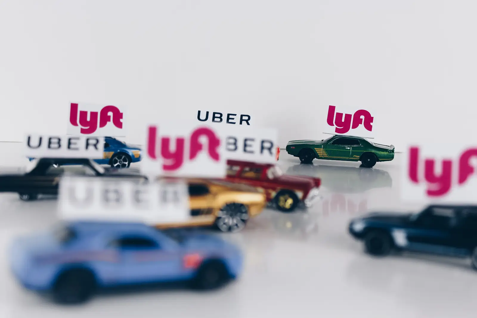 tiny matchbox cars that have uber and lyft on them