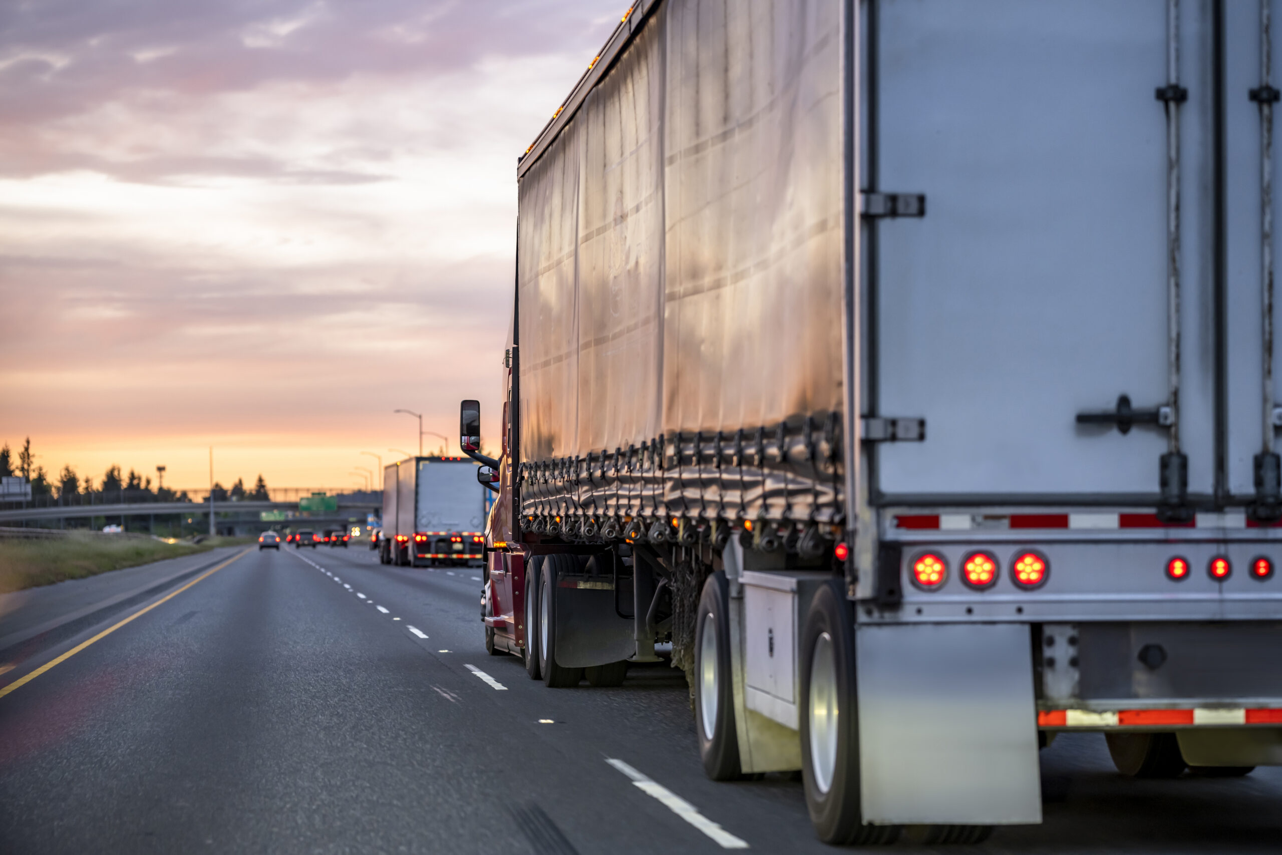 A semi travels down a busy highway 