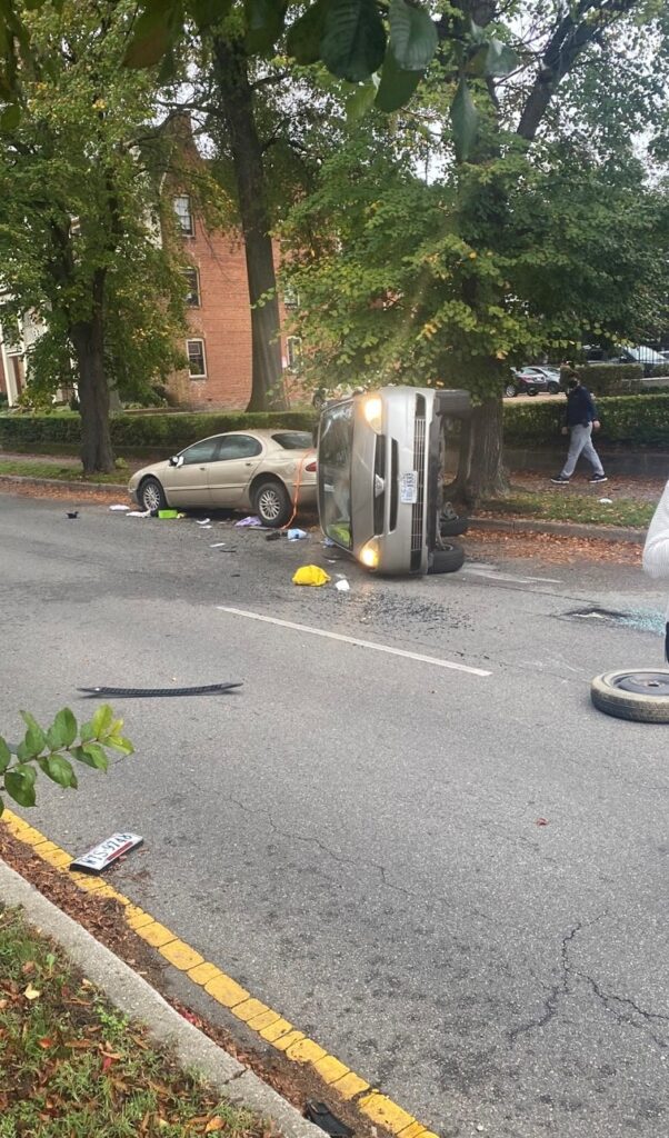 A car is tipped over onto its side after a car accident in Virginia.