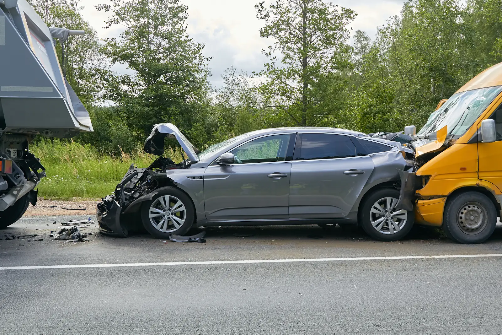 three car accident in virginia with a yellow van, grey car, and truck. rear end accident