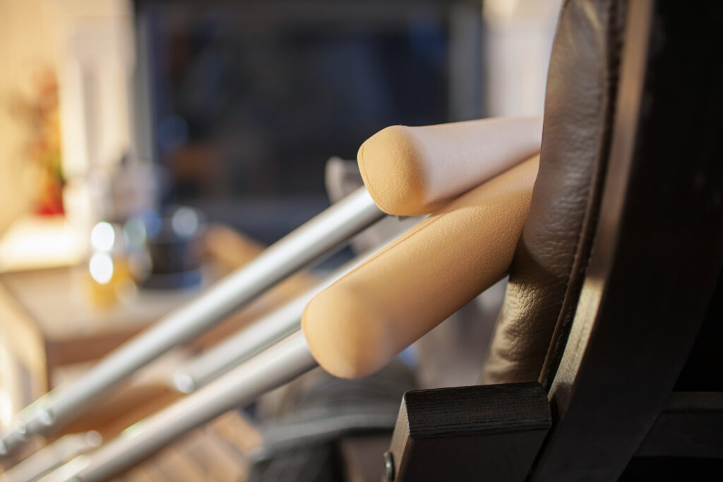 crutches lean against a chair.