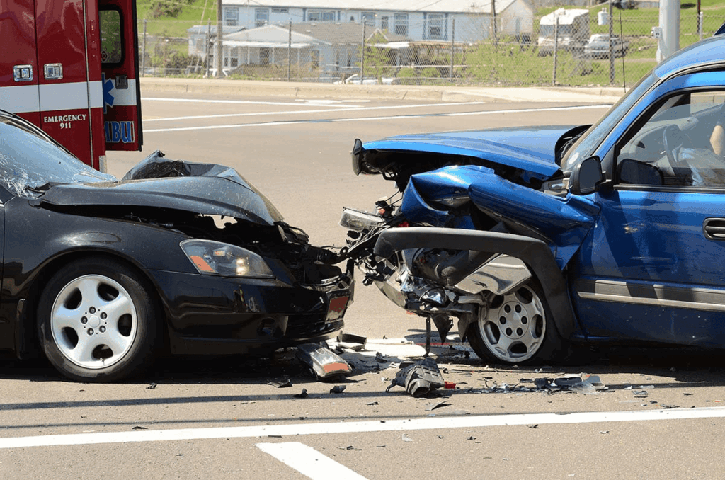 Two cars with front end damage after a head-on collision that resulted in multiple injuries to the occupants of the vehicle.